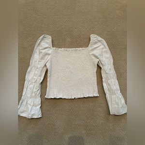 Women’s white long sleeve top size medium.